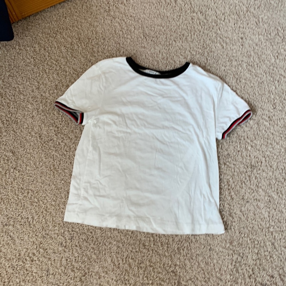 White with red, navy, and grey striped sleeves tee